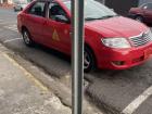 An example of a red taxi in Costa Rica!