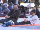 In the late 2000s, Sugar Land Town Center hosted an International Yoga Day featured in The Houston Chronicle; here's Dad and me in one of the photos!