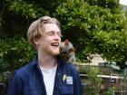 Sam with an opossum on his shoulder