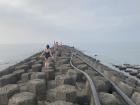 A seawall extending from a beach in North Taiwan towards China
