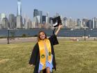Wearing my graduation cap, gown and honor stools at Liberty State Park in Jersey City