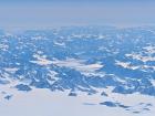 Flying over Greenland you can see the ice sheet, glaciers, mountains, and the ocean in the distance!