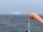 A massive iceberg in the distance