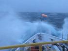 Waves crash over the bow of the JOIDES Resolution