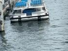 There are many boats on the Seine, some of which rest on the edges of the river for people to sit on, others transport goods and people