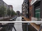 A canal in Copenhagen's newest canal center, Sluseholmen--the houses on either side of the canal have their own canoe!