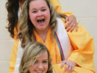 With friends at high school graduation