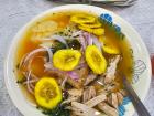 We made Ecuador's national food, encebollado, or an onion soup with fish, yuca, onions and chifles (plantain chips) on top.... or popcorn, if you eat it Andean-style!