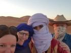 Mom, Dad, and me with our guide, Mohammad, in the Sahara