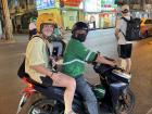 Here I am on a motorbike taxi with my own helmet that a friend decorated for me