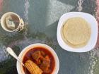 This is me eating "mole de olla" on the patio right next to where I live! 