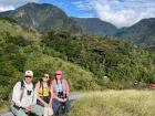 Me and my parents taking a rest on a long hike. You can see the clouds not too far in the distance