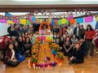 With friends in front of the altar we made for Día de Muertos.