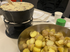 An enriched version of the original Swiss cheese fondue, now with added mushrooms and potatoes for dipping
