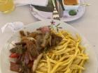 A second course from one of the menu restaurants, "lomo saltado" and "tallarines a la huancaina"