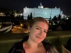 Me on a rooftop, overlooking the Madrid palace