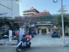 FoodPanda delivery service scooter pulling out of 7/11