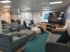 Our ship also has a living room for casual hangouts and activities, including a ping-pong table and a dart board