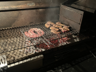 Boerewors and lamb cooking on the braai