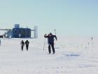 Participants make their way through the 2-mile race with the IceCube Lab building in the background