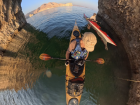 Paddling through a rocky sea cave