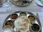 A traditional lunch in Madhya Pradesh served on a metal platter called a thali