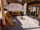 A simple outdoor hearth and seating area, used for cooking, warming food, and gathering together. Fire plays a central role in food preparation in Ladakh