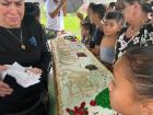 Cutting cake for Tronadora's 70th anniversary