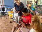 Peace Corps volunteer working with MEP teachers