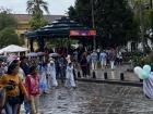 There was a school parade with students in traditional clothing from different sectors.