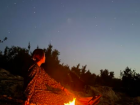 Me next to a campfire just outside my town 