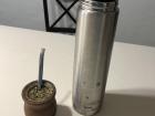 A thermos is typically used to add hot water to the mate leaves