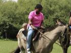 Attempting to ride a horse at a traditional gaucho estancia (an Argentine cowboy ranch)