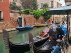 These are gondolas that tourists use for local transportation in Venice! Other kinds of boats are available for public transportation for the locals