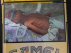 WARNING: This image contains a image of a newborn baby affected by the mother's smoking habits. Cigarette boxes with these images and warnings are very common in Europe.