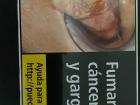 WARNING: This image contains an unpleasant image of a person's tongue affected by smoking. Cigarette boxes with these images and warnings are very common in Europe.