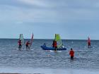 I am the one with the green sail, windsurfing out into the Mediterranean Sea
