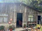 Matias' house made of wood and metal roofing