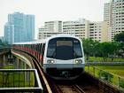 A MRT train heading into an above ground station