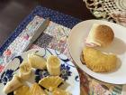 Typical breakfast with an empanada de chiverre and a side of fresh fruit.