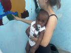 Everyone's baby is everyone else's baby, so neighboring children come over to my house often to draw with chalk or just hang out. In the village setting, any and all children are the responsibility of whoever happens to be there.