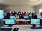 Teachers standing in the school computer lab