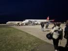 Walking on the runway to board a plane