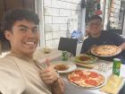Eating pizza with my best friend from high school in Italy... it’s a tiny world out there!