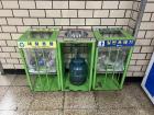 Recycling bins and a jug to collect liquids