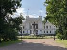 Main university buidling and fountain, as seen from a walking path in the park. 