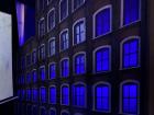 The blue lights set the tonal atmosphere for this scene.