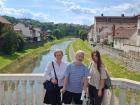 Mirjana, who owns the language school, her husband Dušan, and me in front of the Kolubara river