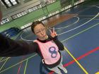 Wearing a pink jersey for a basketball game in one of my eighth grade PE classes