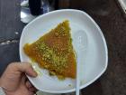 I couldn't leave without getting one more piece of my favorite desert; a sweet cheese, syrup and nut treat called "kanafeh"